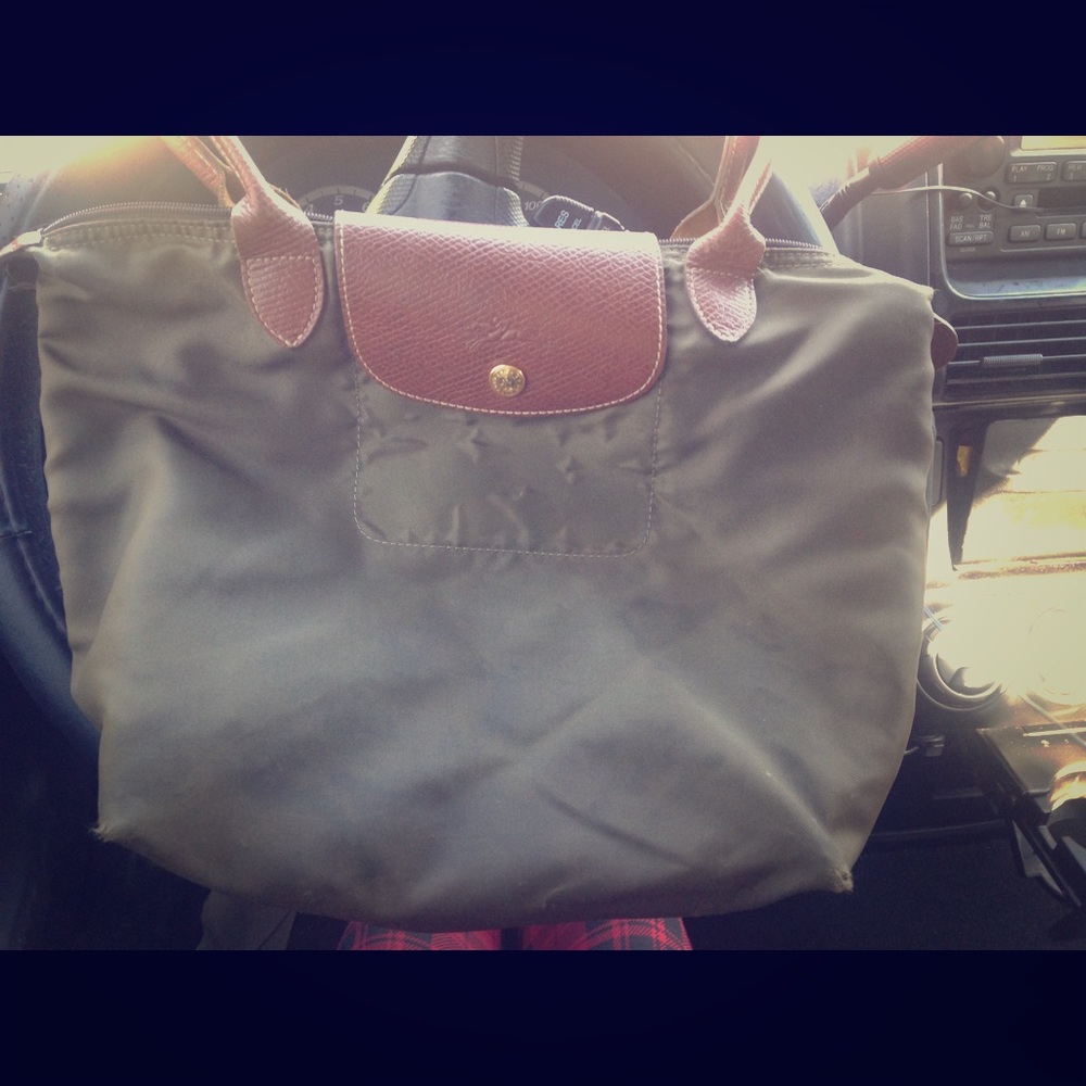 Green Longchamp Le Pliage with light wear